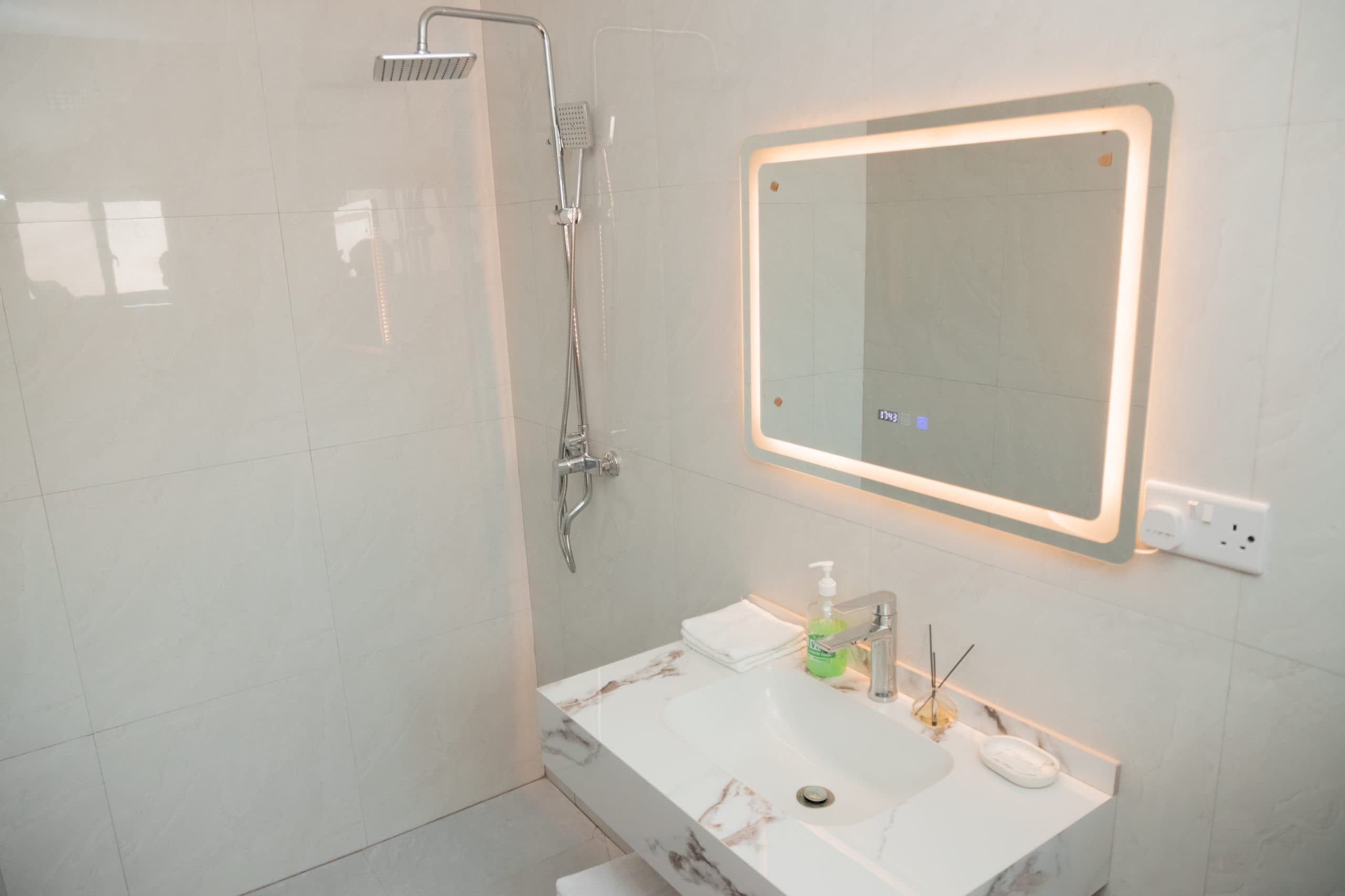 The second bathroom in Mandela, shower and basin